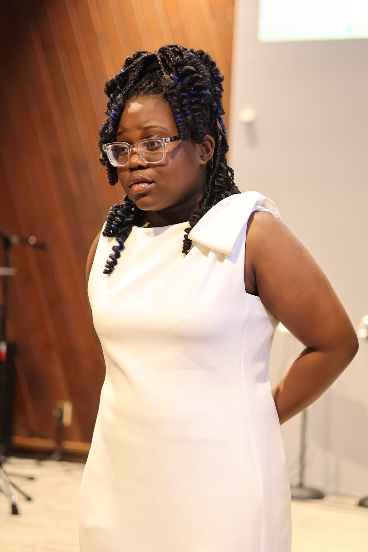 Young woman participating in church service at Valley of Oaks Church