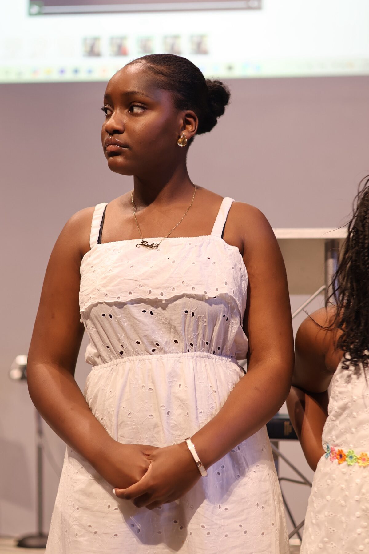 Young woman standing in the Valley of Oaks Church sanctuary