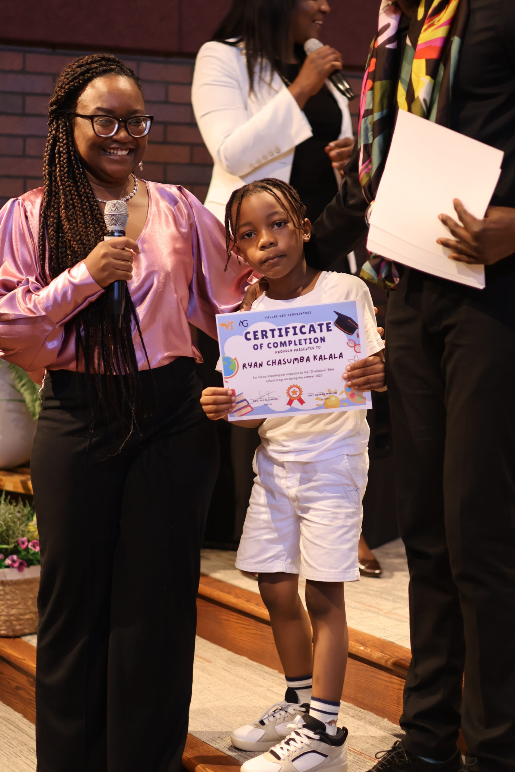 A child celebrating completion of church summer school